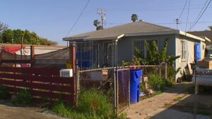 Police find body in home where woman says she was held captive