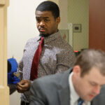 Dedrick Williams enters the courtroom
