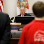 Aiden Fucci stands before Judge R. Lee Smith