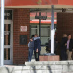 People gather after students were released following a fight at Montgomery High School in Santa Rosa, Calif.