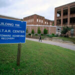 Visitors walk toward Building 114, the S.T.A.R. Center