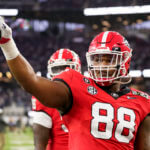 Jalen Carter (88) waves to the crowd before the national championship NCAA College Football Playoff game between Georgia and TCU