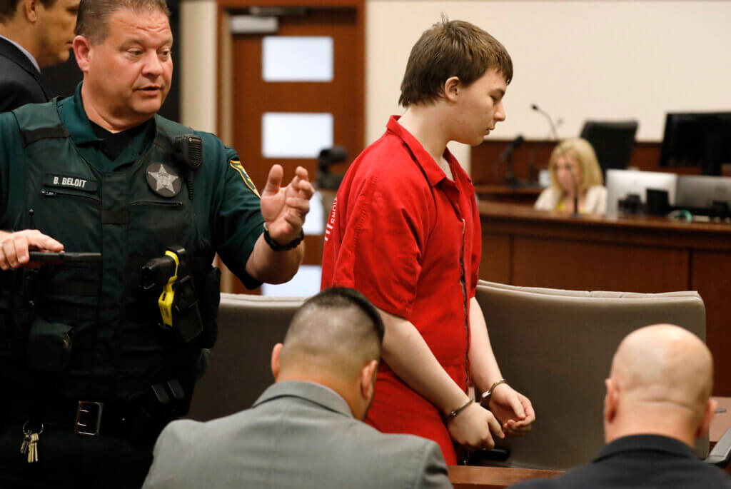 Aiden Fucci is led into the courtroom