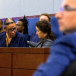 Nathan Chasing Horse speaks with his public defender on April 3, 2023.