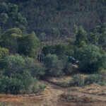 Police work on the banks of the Arade dam