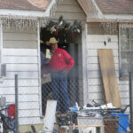 San Jacinto County Sheriff Greg Capers talks to investigators at the scene where five people were shot and killed