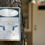 A warning sign is seen Sunday, April 30, 2023, outside the home where a mass shooting occurred