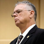 Former Marjory Stoneman Douglas High School School Resource Officer Scot Peterson stands in court.