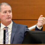 Jeffrey Heinrich points to the defendant as he testifies during the trial of Scot Peterson