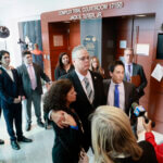 Former Marjory Stoneman Douglas High School School Resource Officer Scot Peterson with his wife and attorney.