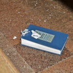 bullet-damaged prayer book