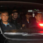 Joran van der Sloot is driven away from prison in a police vehicle.