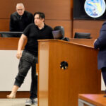 Kyle Laman shows his injured right foot as he testifies in the trial of Scot Peterson