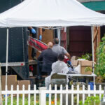 Authorities search the home of suspect Rex Heuermann.