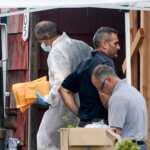 Authorities search the home of suspect Rex Heuermann.