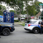 Authorities search the home of suspect Rex Heuermann.