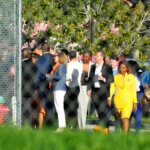 Nine members of Congress and others wait to enter Marjory Stoneman Douglas High School