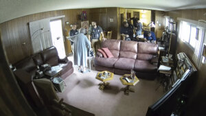 Video shows 98-year-old mother of newspaper publisher upset amid raid