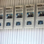 Front pages for the Marion County Record's latest weekly edition are displayed on a window at its offices.