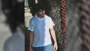 Escaped murderer stole rifle, remains at large