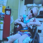 Maya Kowalski sits in a wheelchair