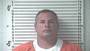 Judge will stay on case after denying Brooks Houck request