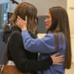Caitlin Cash stands outside of court
