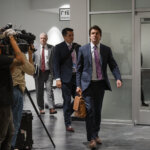 Defense attorney Geoffrey Puryear leaves the courtroom