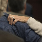 Karen Wilson, mother of Anna Moriah Wilson, grips the shoulder of her husband, Eric Wilson, during the sentencing portion of Kaitlin Armstrong's murder trial at the Blackwell-Thurman Criminal Justice Center on Friday, Nov. 17, 2023. Armstrong was found guilty of killing Anna Moriah Wilson in May 2022 and sentenced to 90 years in prison.