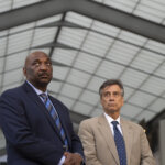Attorneys stand outside court