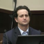 Charles Adelson listens to the verdict