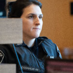 Police officer sits on the stand
