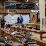 Hasidic Jewish students observe as law enforcement establishes a perimeter