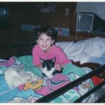 Gypsy and one of her many childhood cats, Miss Kitty.