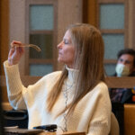Michelle Troconis looks at her glasses