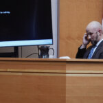 Matthew Larochelle listens to an audio recording of Adam Montgomery