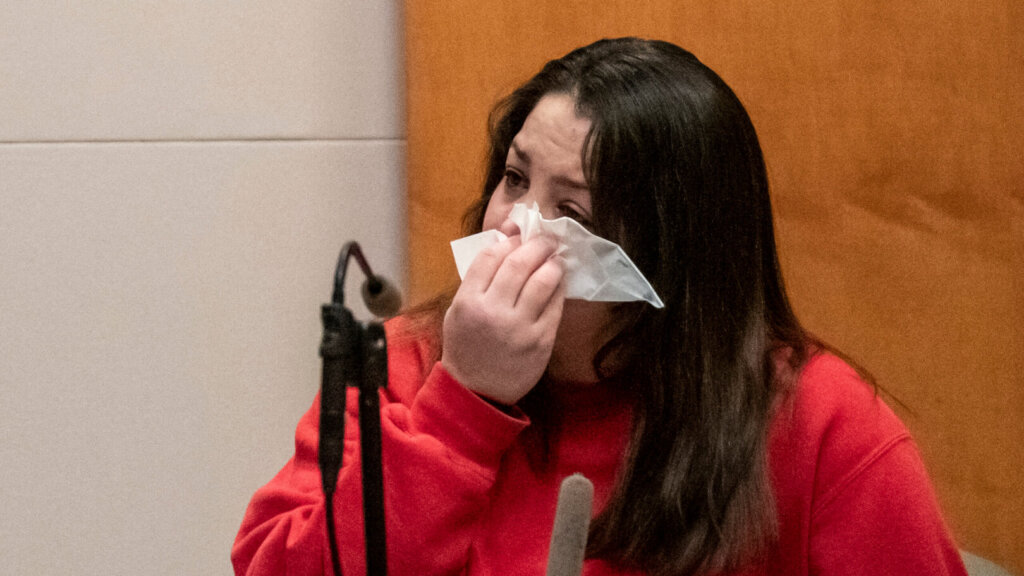 Kayla Montgomery wipes her eyes