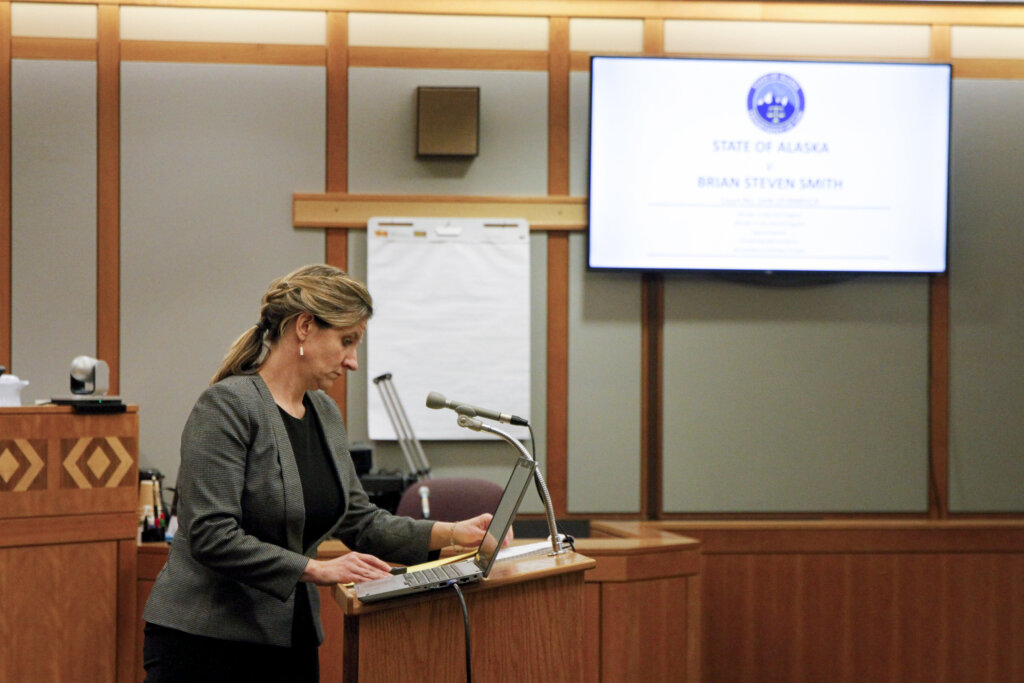 A woman addresses the court