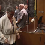 Jennifer Crumbley is led out of court in shackles