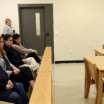 people watch a parole board hearing