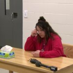 Kayla Montgomery wipes away a tear