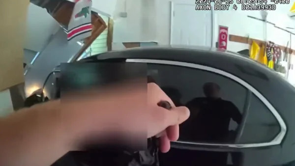 Body cam: Mother pinned against wall with car killed, 2 officers injured