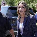 Karen Read, center, walks toward Norfolk Superior Court