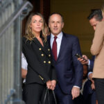 Karen Read, left, stands in a doorway near defense attorney David Yannetti