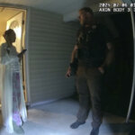 woman talks to officer
