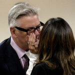 man kisses wife