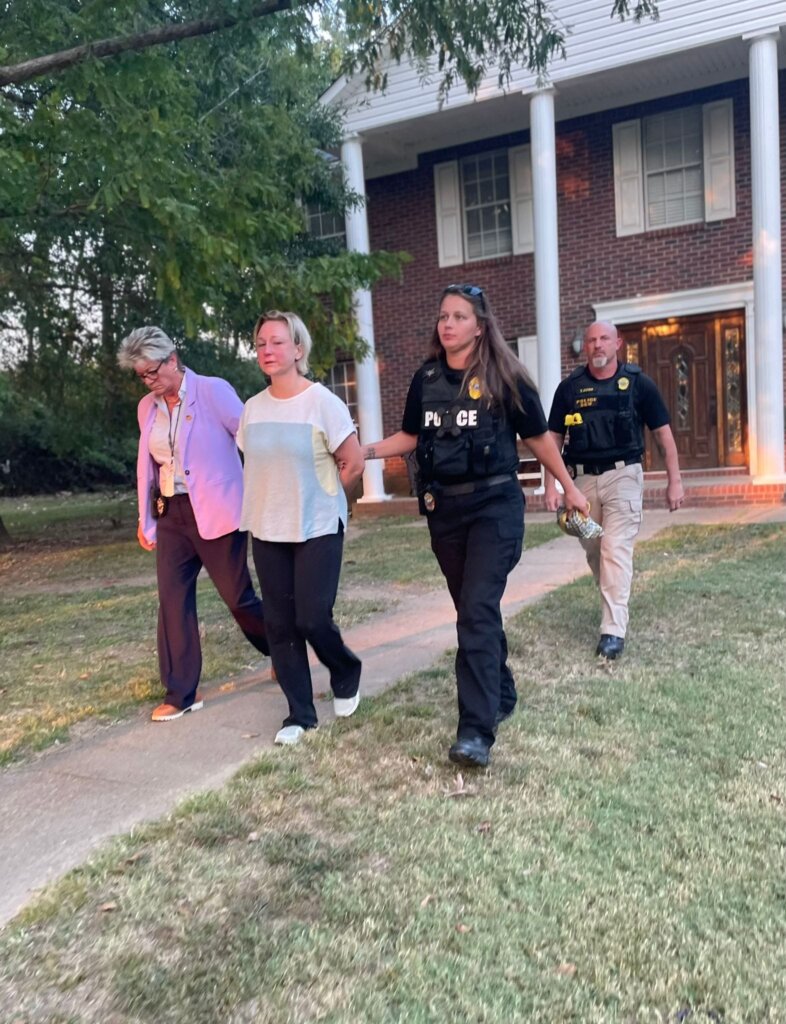 Alissa McCommon walks in handcuffs