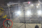 man with backpack circled in surveillance photo