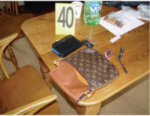 purse on table with evidence marker
