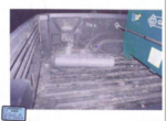 A roll of chicken wire is seen in the bed of a pickup truck